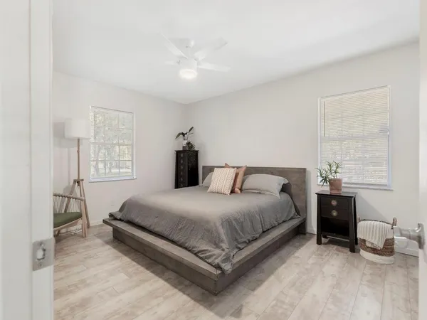 a bedroom with a bed and window