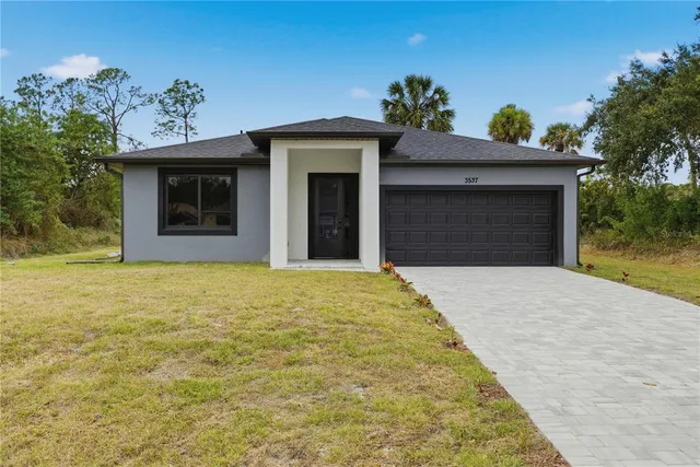 a view of a house with a garage