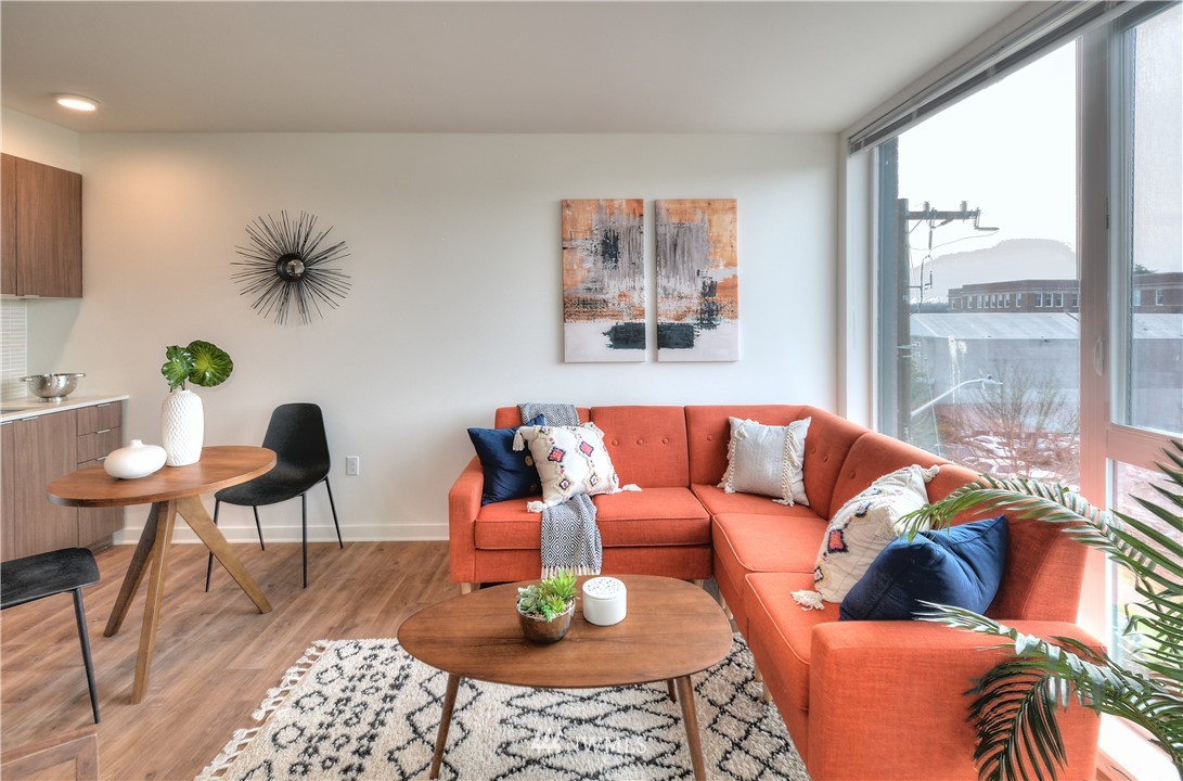 1601 North 45th Street, Unit 411 Seattle, WA 98103 - Photo 1 of 33 a living room with furniture and a large window