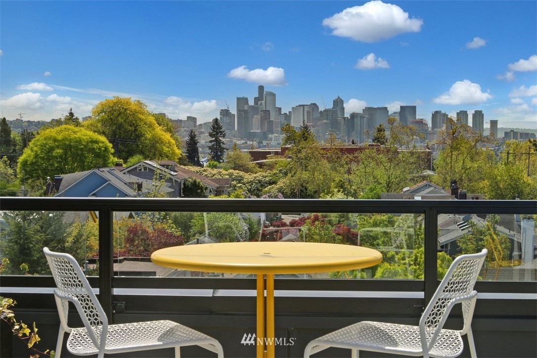 1601 North 45th Street, Unit 411 Seattle, WA 98103 - Photo 2 of 33 a view of a balcony with furniture