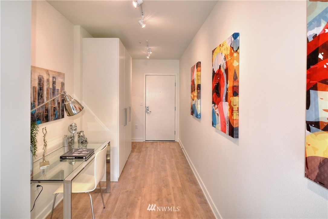 1601 North 45th Street, Unit 411 Seattle, WA 98103 - Photo 11 of 33 a view of a bedroom with wooden floor and entryway