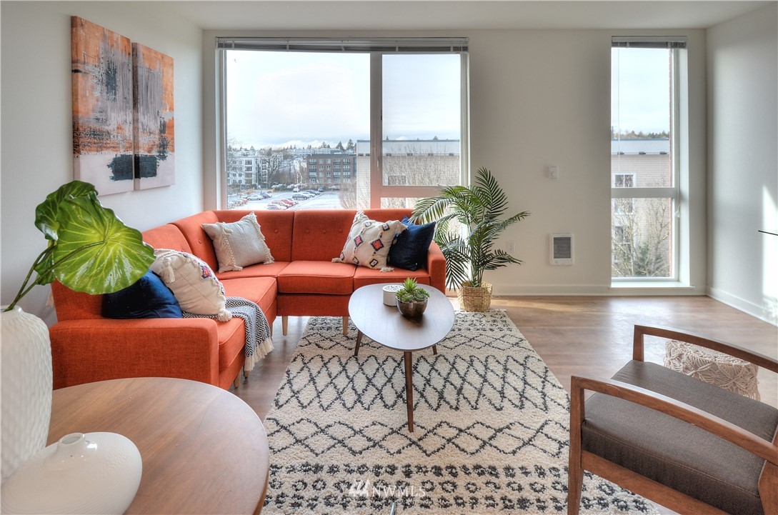1601 North 45th Street, Unit 411 Seattle, WA 98103 - Photo 21 of 33 a living room with furniture and a large window