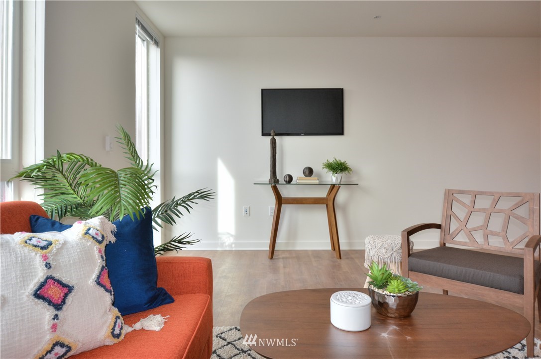 1601 North 45th Street, Unit 411 Seattle, WA 98103 - Photo 23 of 33 a living room with furniture and potted plant