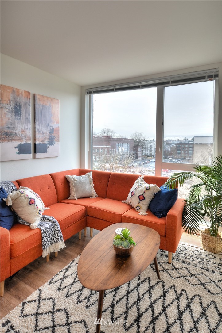 1601 North 45th Street, Unit 411 Seattle, WA 98103 - Photo 24 of 33 a living room with furniture and a large window