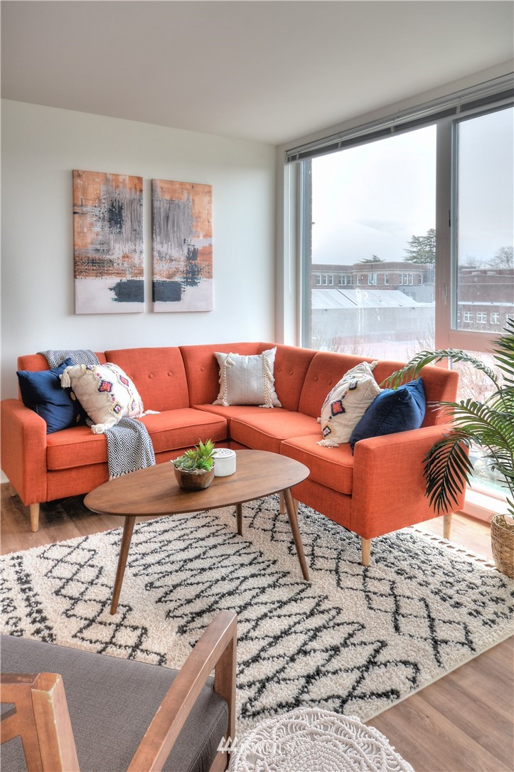 1601 North 45th Street, Unit 411 Seattle, WA 98103 - Photo 25 of 33 a living room with furniture and a large window