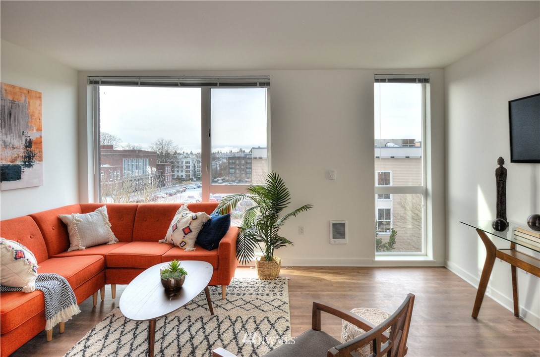 1601 North 45th Street, Unit 411 Seattle, WA 98103 - Photo 27 of 33 a living room with furniture and a large window