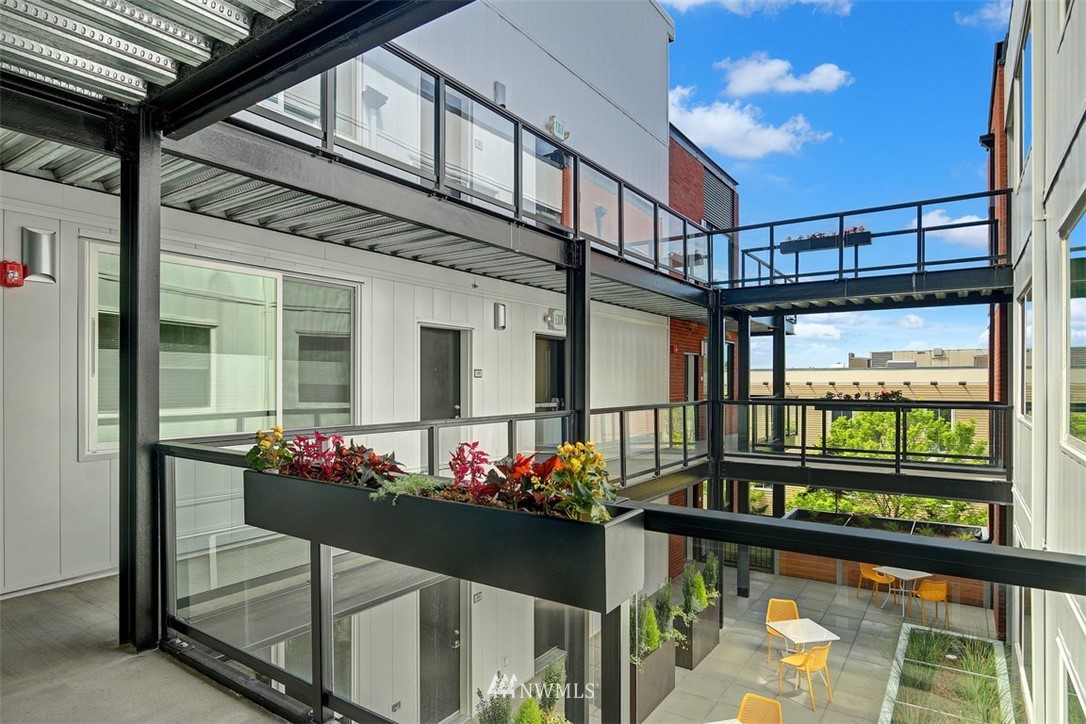 1601 North 45th Street, Unit 411 Seattle, WA 98103 - Photo 6 of 33 a outdoor space with lots of potted plants