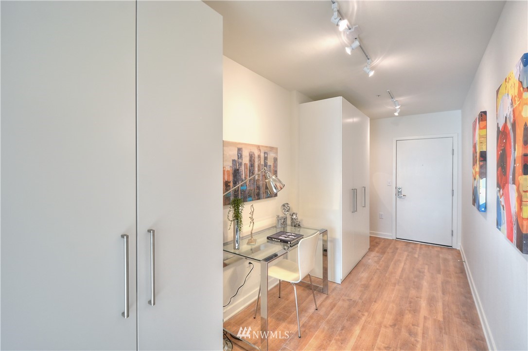 1601 North 45th Street, Unit 411 Seattle, WA 98103 - Photo 8 of 33 a very nice looking room with a wooden floor