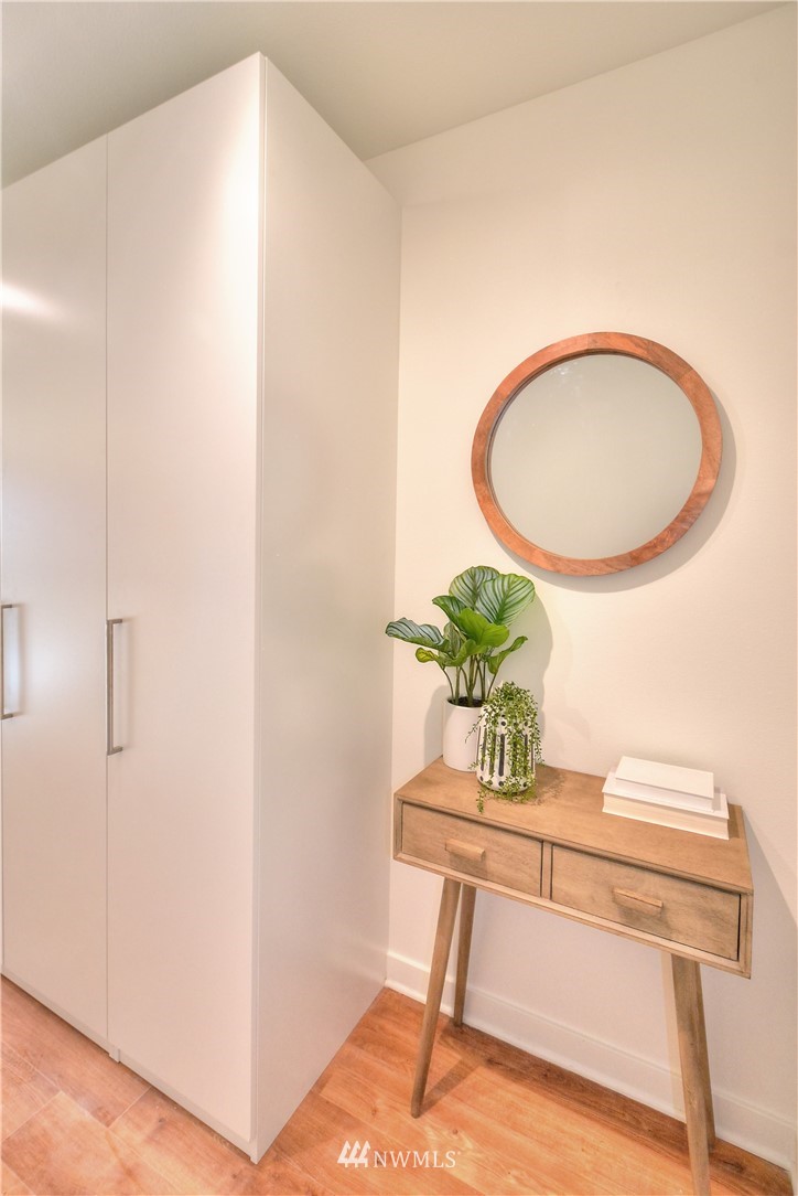 1601 North 45th Street, Unit 411 Seattle, WA 98103 - Photo 10 of 33 a dining room with furniture and a potted plant