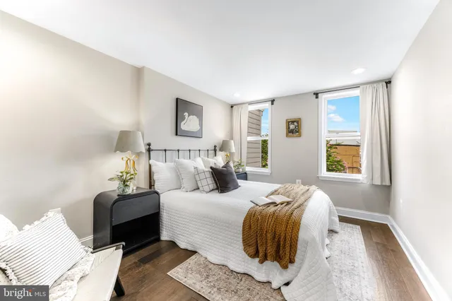 a bedroom with bed and a window