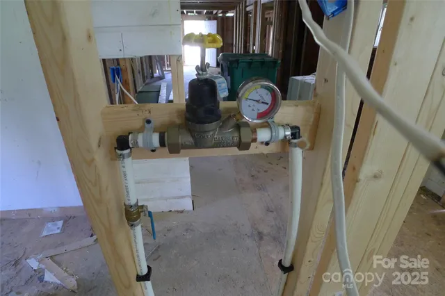a view of walk in closet with clothes