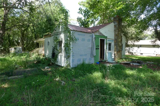 a view of a hallway with a living room