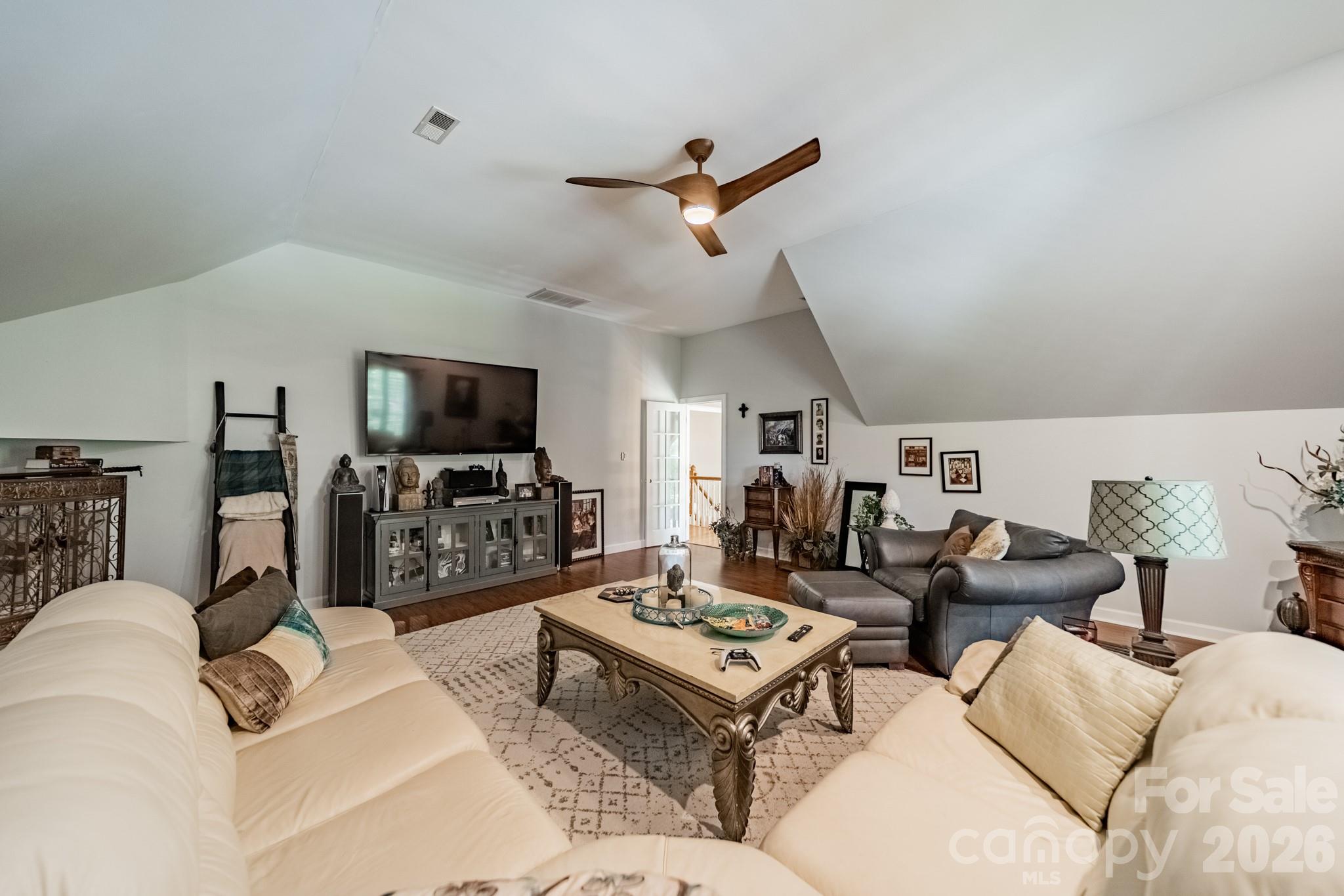 11043 Seven Coves Drive Tega Cay, SC 29708 - Photo 39 of 45 a living room with furniture and a flat screen tv