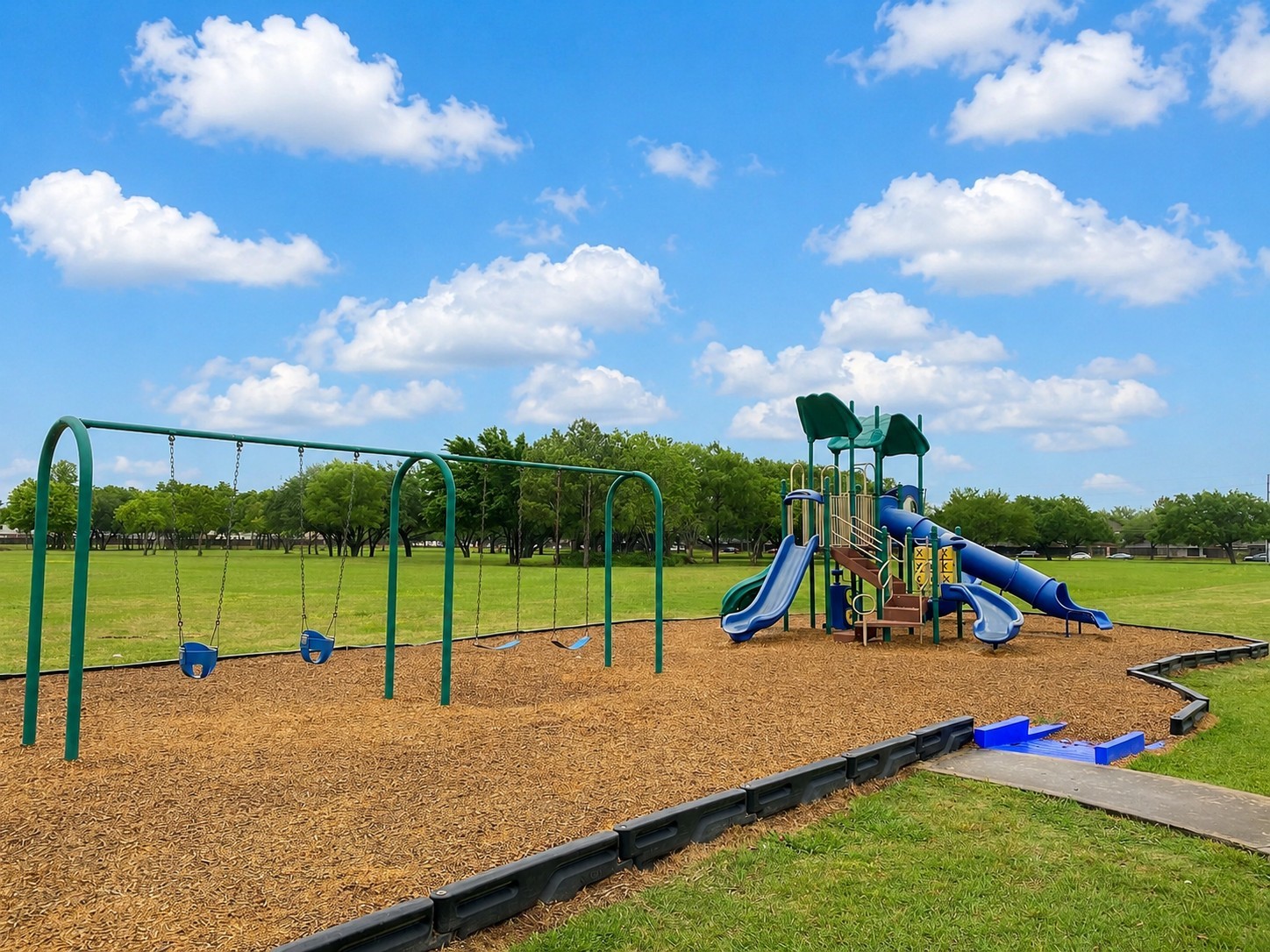 19422 Harvest Stream Way Houston, TX 77084 - Photo 36 of 41 Discover the charm of Lake Ridge with its inviting neighborhood park, featuring a vibrant playground set against a backdrop of lush greenery and open skies.