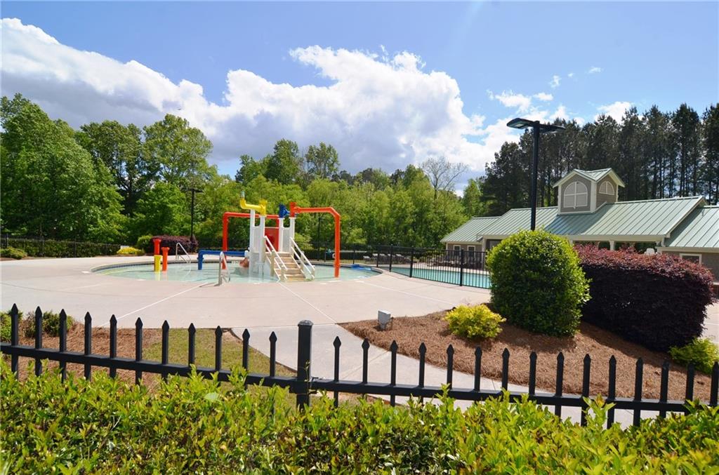 788 Highcrest Drive Acworth, GA 30101 - Photo 101 of 103 a view of an chairs and table in the backyard