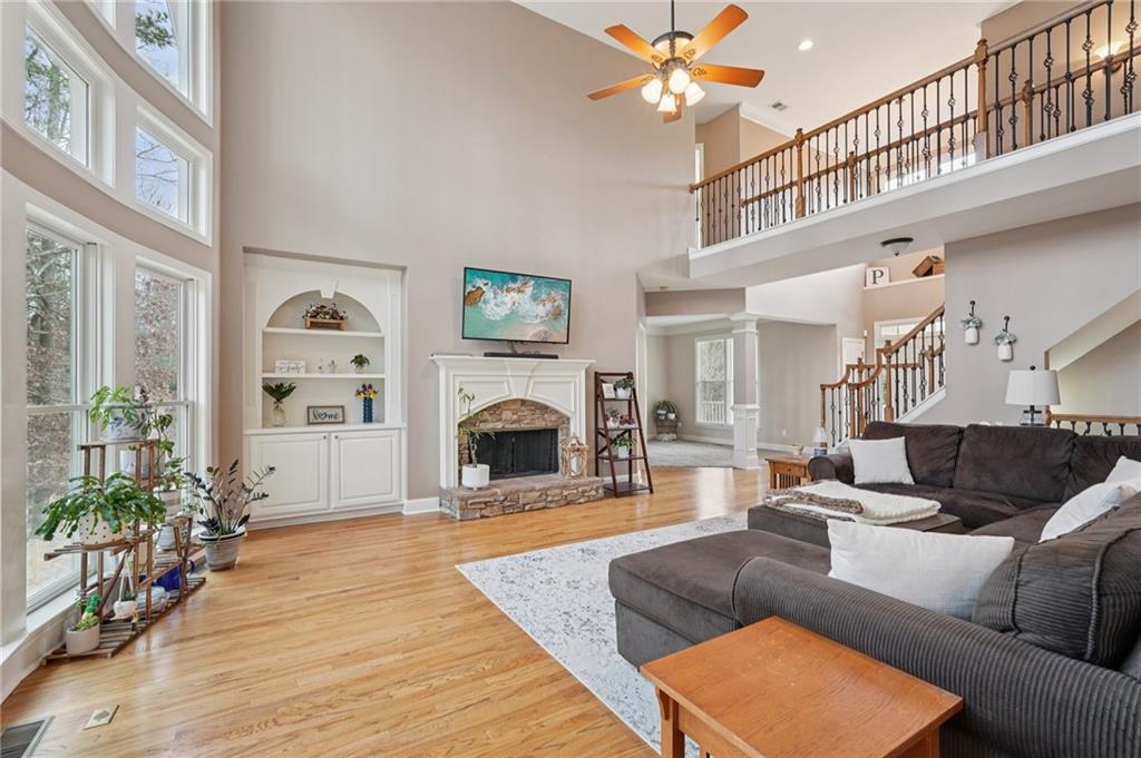 788 Highcrest Drive Acworth, GA 30101 - Photo 3 of 103 a living room with furniture and a fireplace