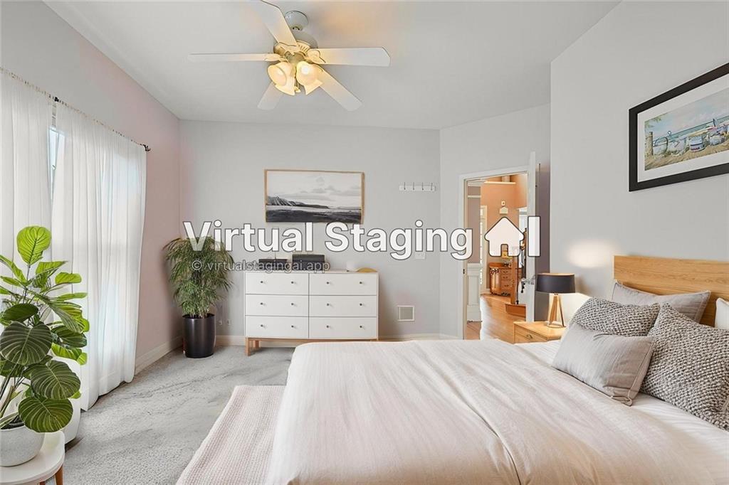 788 Highcrest Drive Acworth, GA 30101 - Photo 33 of 103 a bedroom with a bed and a chandelier