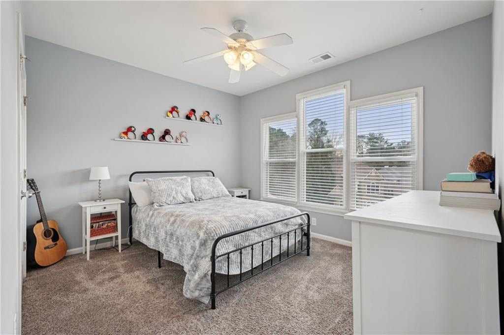 788 Highcrest Drive Acworth, GA 30101 - Photo 45 of 103 a bedroom with a bed and a large window