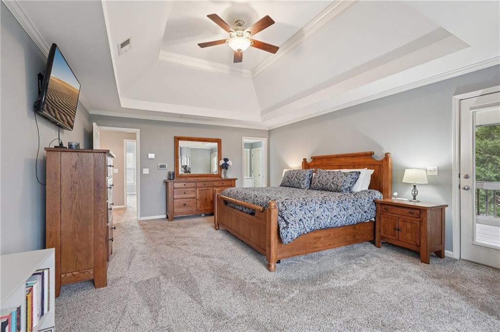 788 Highcrest Drive Acworth, GA 30101 - Photo 50 of 103 a bedroom with a bed dresser and a flat tv screen