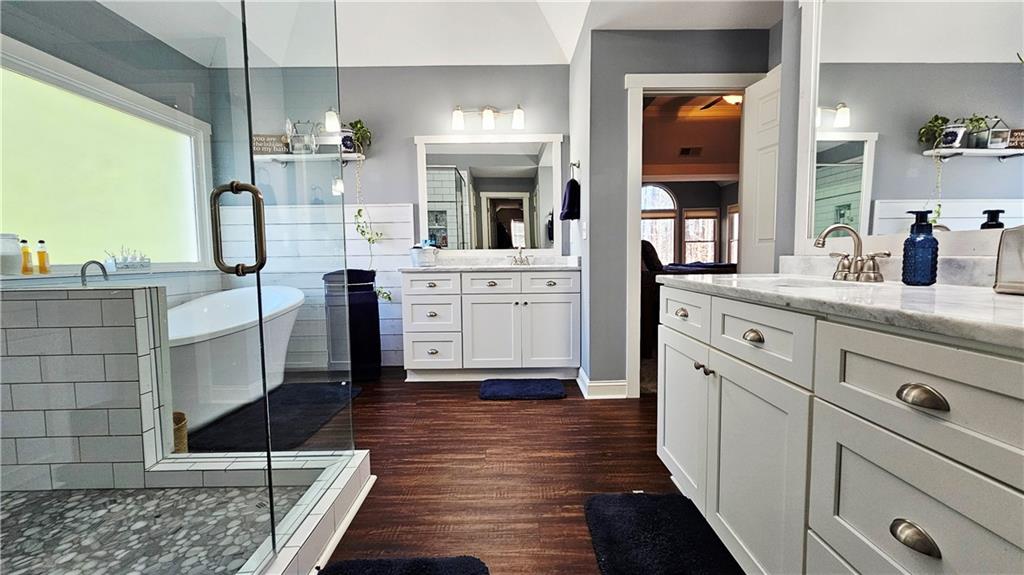 788 Highcrest Drive Acworth, GA 30101 - Photo 60 of 103 a kitchen with stainless steel appliances kitchen island granite countertop a refrigerator and cabinets