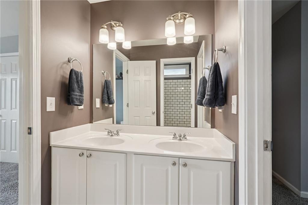 788 Highcrest Drive Acworth, GA 30101 - Photo 67 of 103 a bathroom with a sink and a mirror