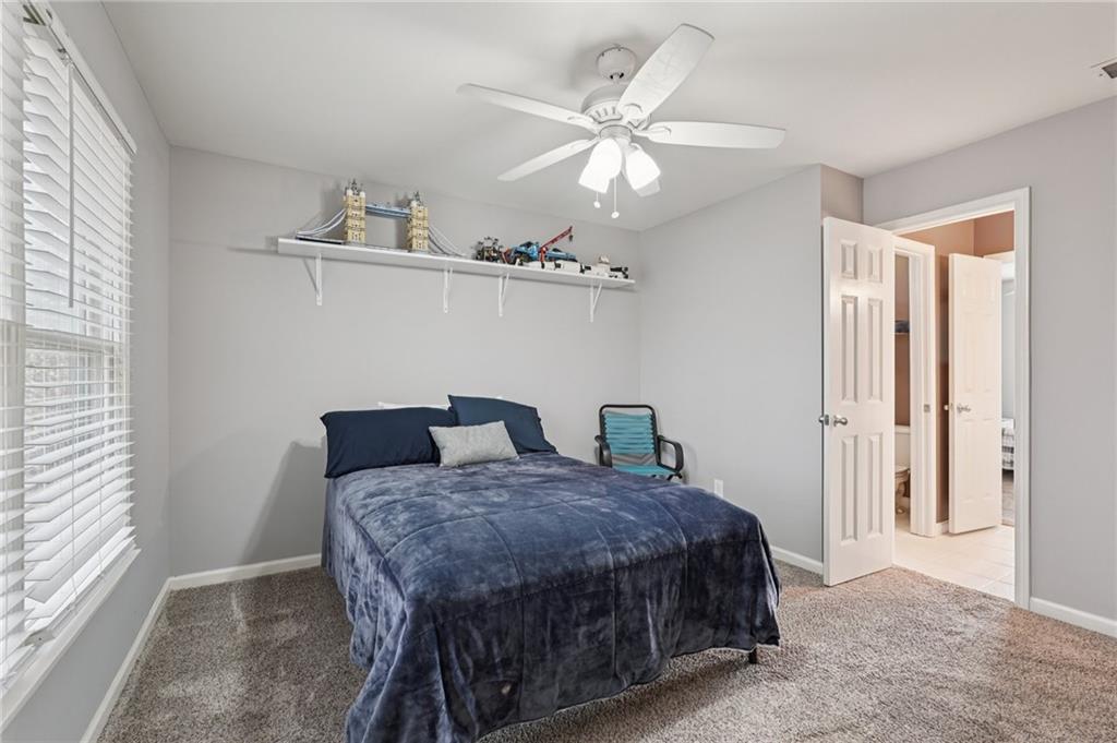 788 Highcrest Drive Acworth, GA 30101 - Photo 70 of 103 a bedroom with a bed and ceiling fan