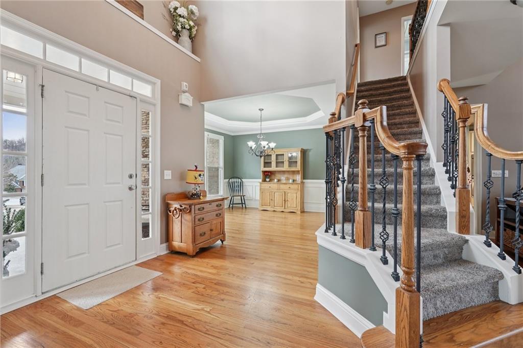 788 Highcrest Drive Acworth, GA 30101 - Photo 8 of 103 a view of a hallway with wooden floor and staircase