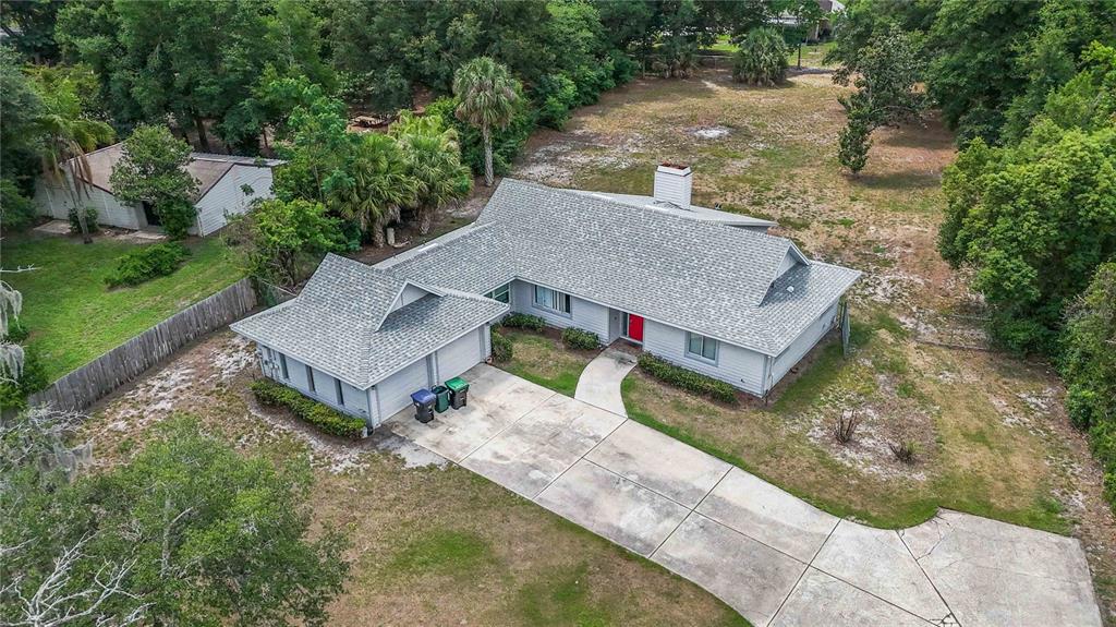 10532 Park Ridge Gotha Road Windermere, FL 34786 - Photo 5 of 6 an aerial view of a house with a yard and trees