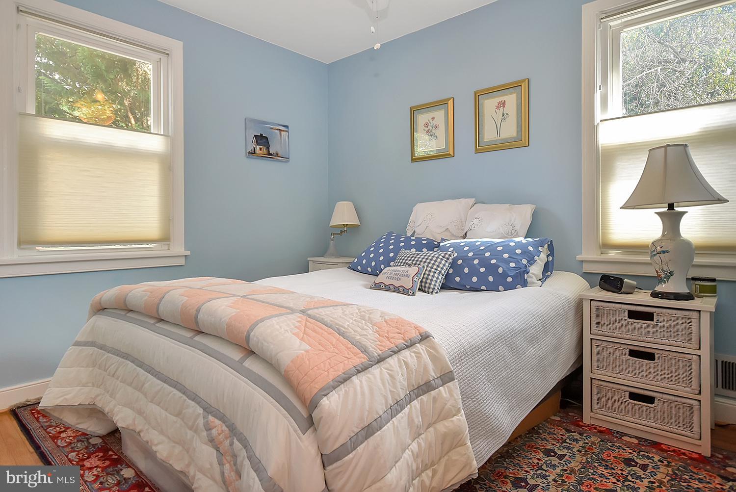 2605 Terrapin Road Silver Spring, MD 20906 - Photo 13 of 30 a bedroom with a bed and a lamp on dresser