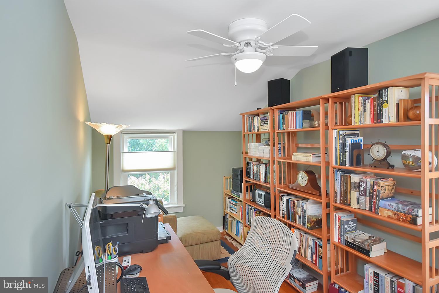 2605 Terrapin Road Silver Spring, MD 20906 - Photo 20 of 30 a living room with fireplace furniture and a book shelf