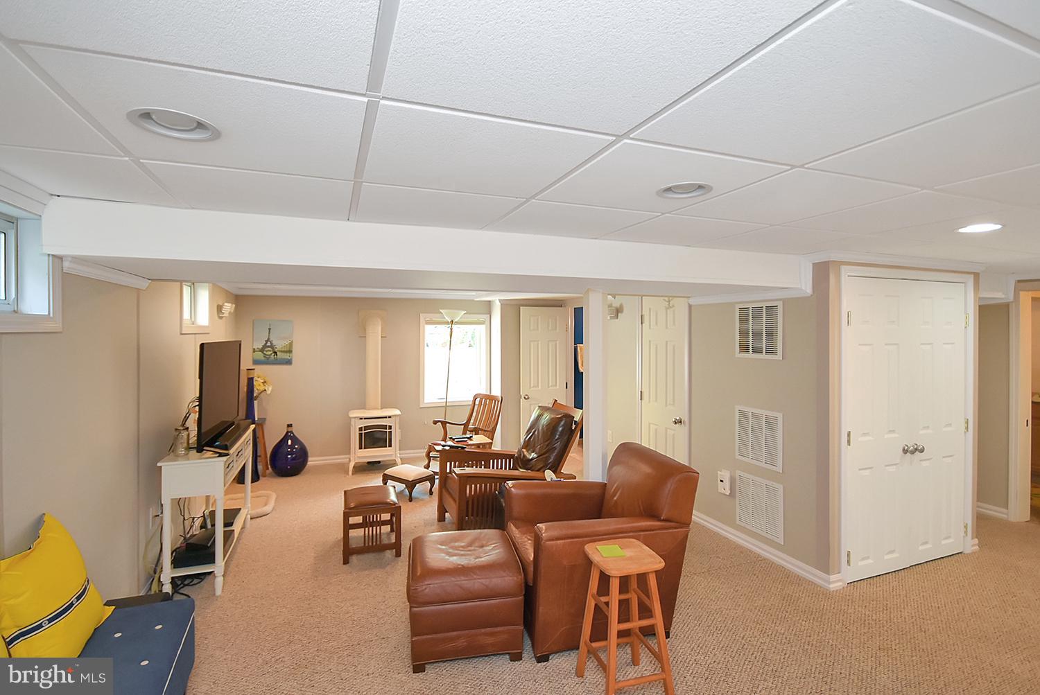 2605 Terrapin Road Silver Spring, MD 20906 - Photo 21 of 30 a living room with furniture a flat screen tv and a window