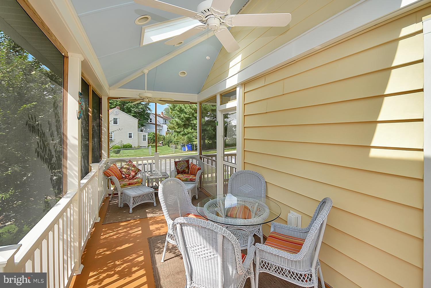 2605 Terrapin Road Silver Spring, MD 20906 - Photo 29 of 30 a view of a patio with table and chairs and wooden floor