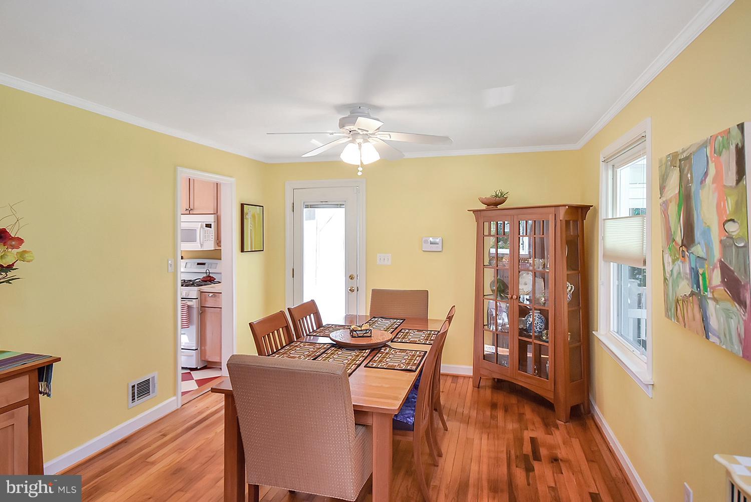 2605 Terrapin Road Silver Spring, MD 20906 - Photo 7 of 30 a view of a dining room with furniture and chandelier