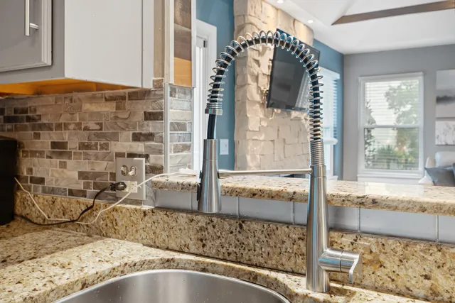 a view of staircase with white walls and a glass door
