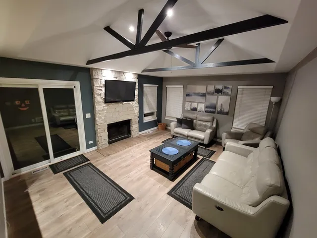 a bedroom with a bed and a view of kitchen