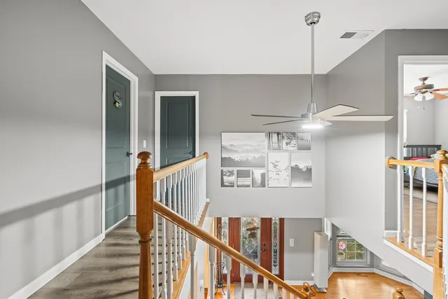 a bathroom with a bathtub shower sink vanity and toilet