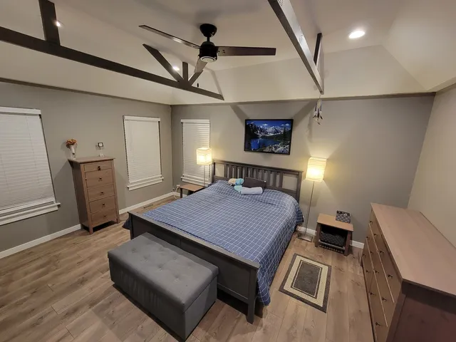 a bathroom with a tub and a window