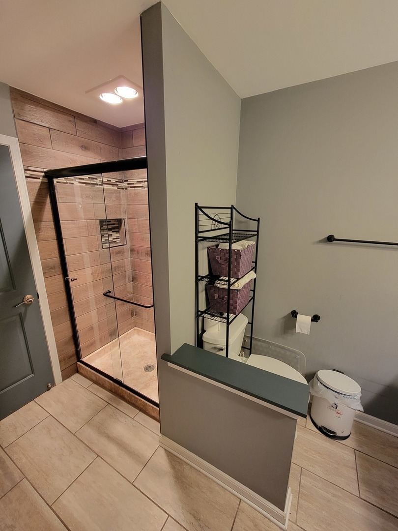 515 Surrey Ridge Drive Cary, IL 60013 - Photo 47 of 71 a bathroom with a toilet and a shower