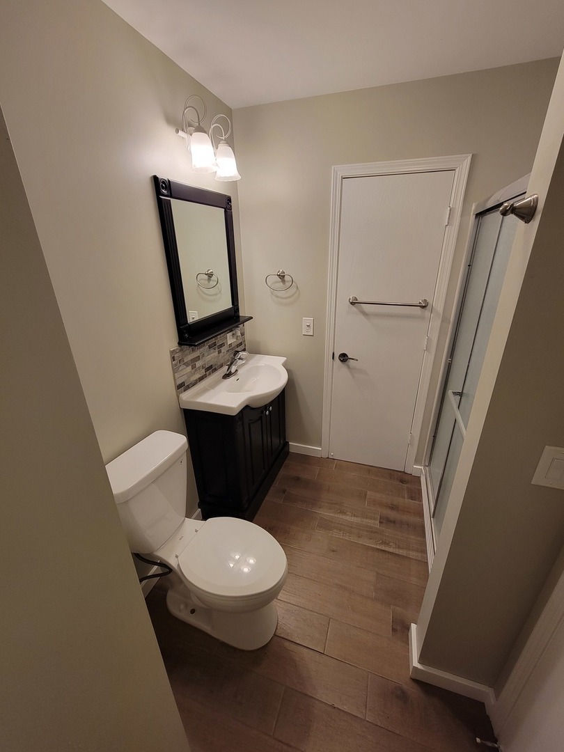 515 Surrey Ridge Drive Cary, IL 60013 - Photo 51 of 71 a white toilet sitting next to a bathroom sink