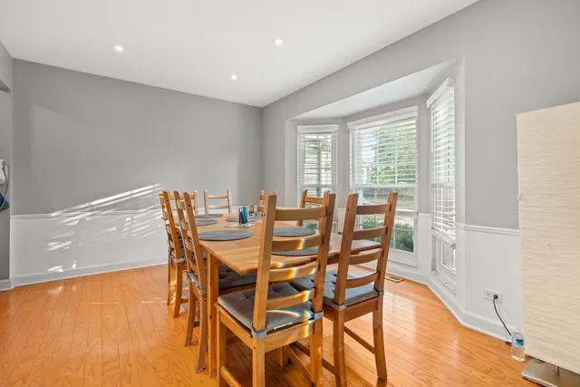 a kitchen with kitchen island cabinets and refrigerator