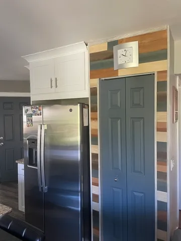 a kitchen with a stove and a refrigerator