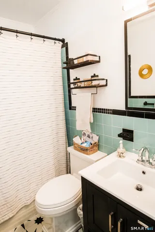 a bathroom with a sink and a toilet