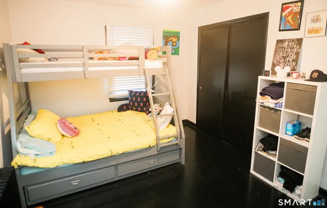 a view of kitchen with furniture and refrigerator