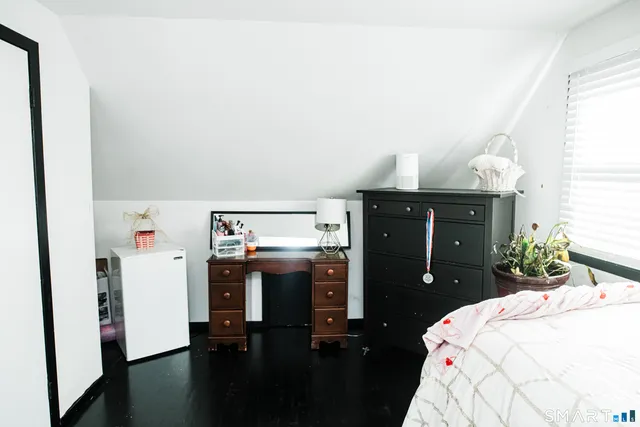 a bedroom with a bed and cabinets