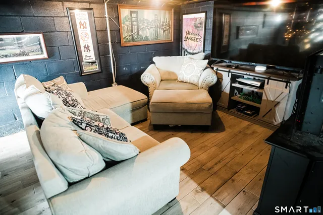 a living room with furniture and a flat screen tv