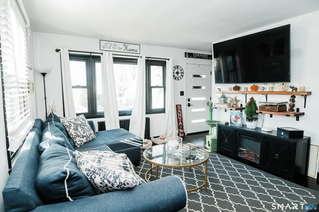 a living room with furniture and a flat screen tv
