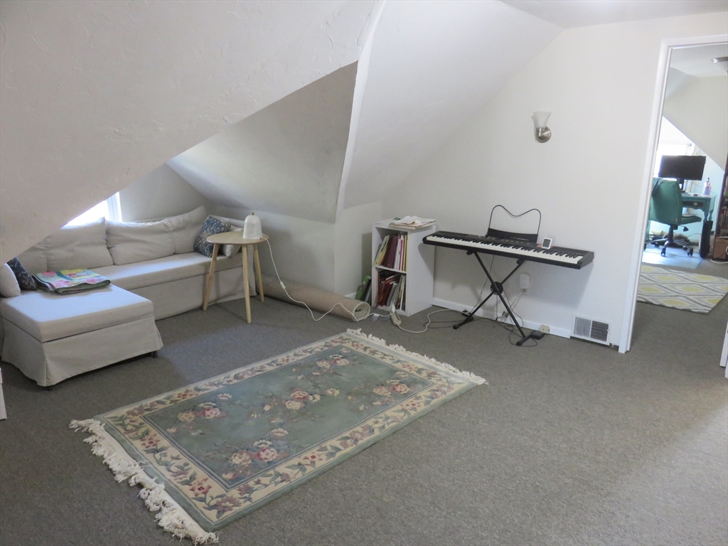 105 Plympton Street, Unit 2 Waltham, MA 02451 - Photo 15 of 27 a living room with furniture and a table