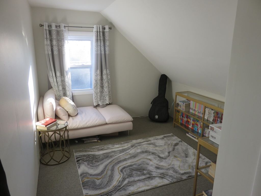 105 Plympton Street, Unit 2 Waltham, MA 02451 - Photo 19 of 27 a living room with furniture