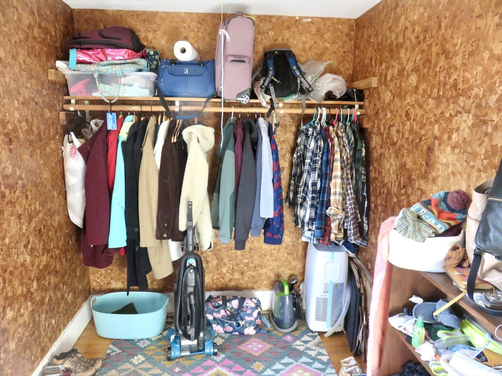105 Plympton Street, Unit 2 Waltham, MA 02451 - Photo 25 of 27 a view of walk in closet with clothes and shoes