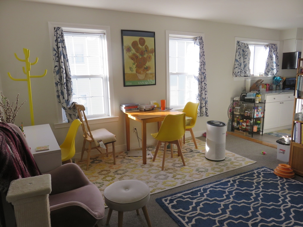 105 Plympton Street, Unit 2 Waltham, MA 02451 - Photo 5 of 27 a dining room with furniture and window